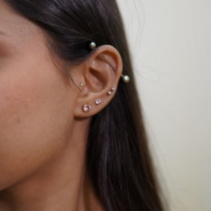 Are Matching Ear Piercings Going Out of Style?